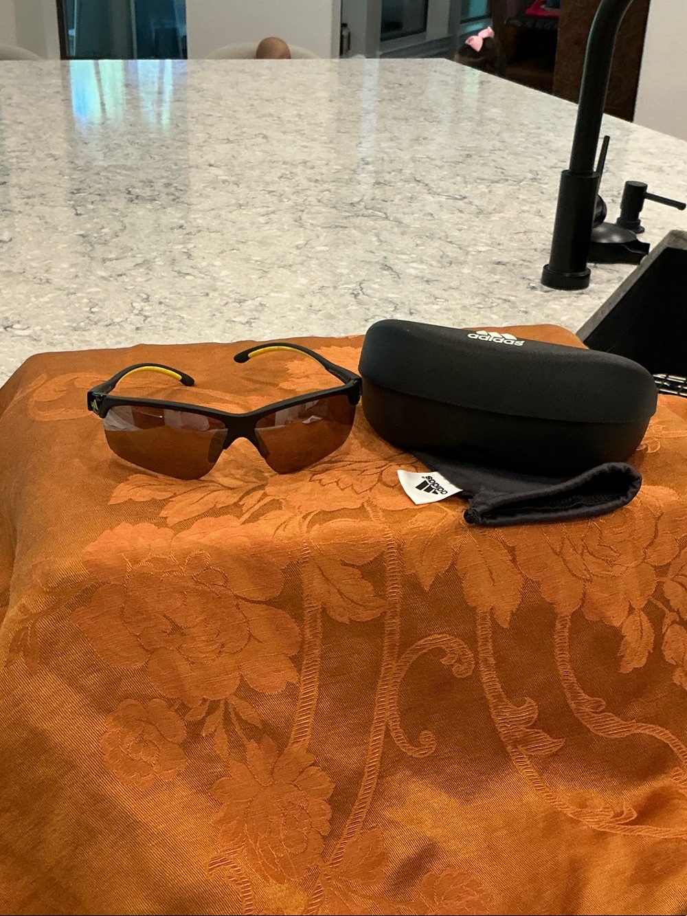 adidas Black Frame Sunglasses with Amber Lenses and Yellow Temple Accents